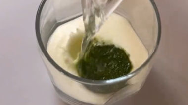 Frozen chaas cubes made with herbs and spices in an ice tray